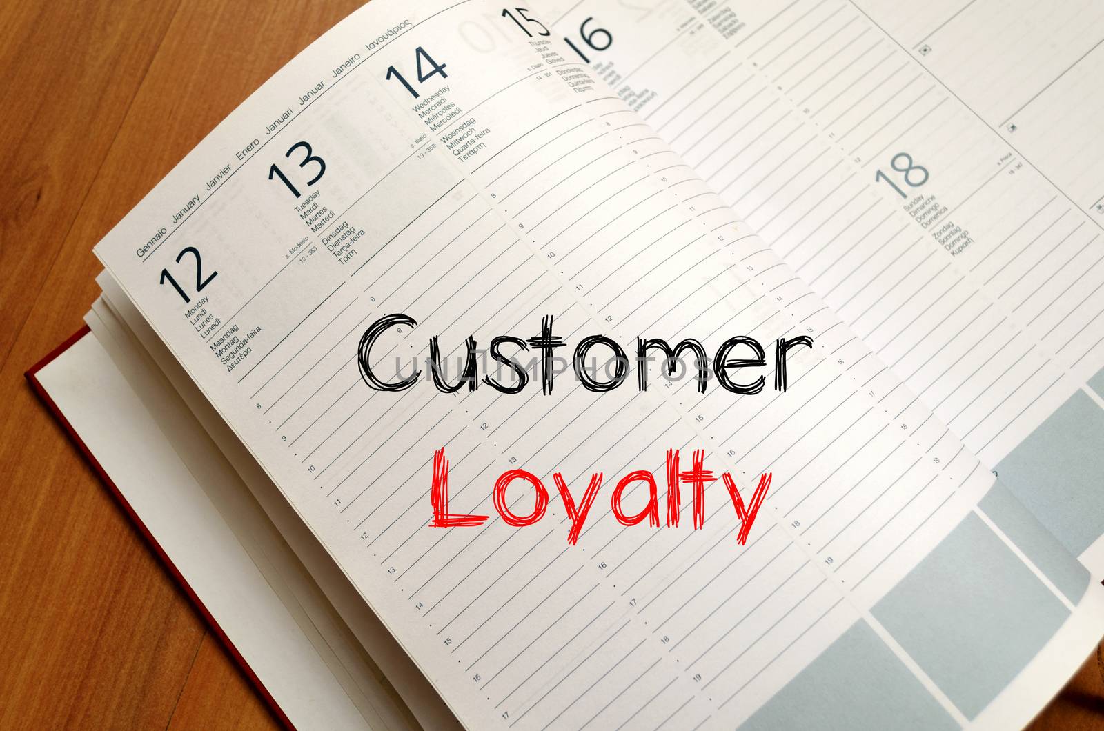 Customer loyalty write on notebook by eenevski