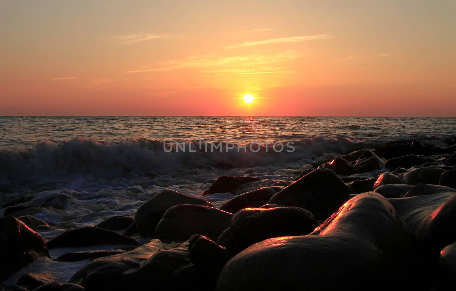 Sunset over the Black sea and summertime beach by scullery