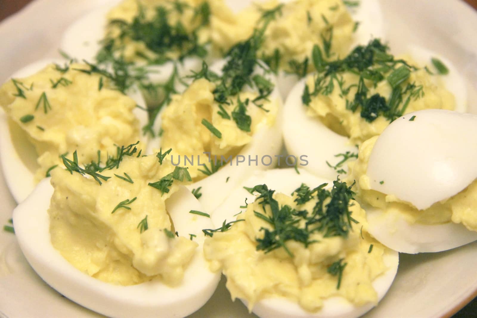 Boiled eggs sliced in halves stuffed and filling by pasta with d by scullery