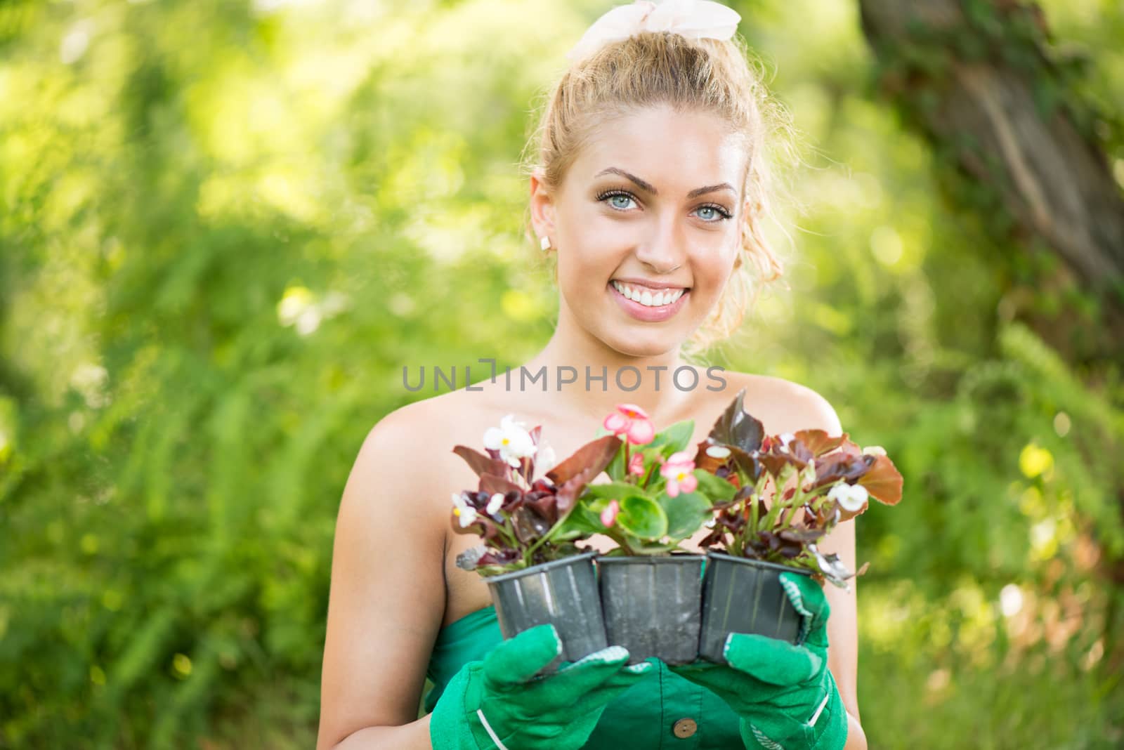 Beautiful Woman Planting Flowers by MilanMarkovic78