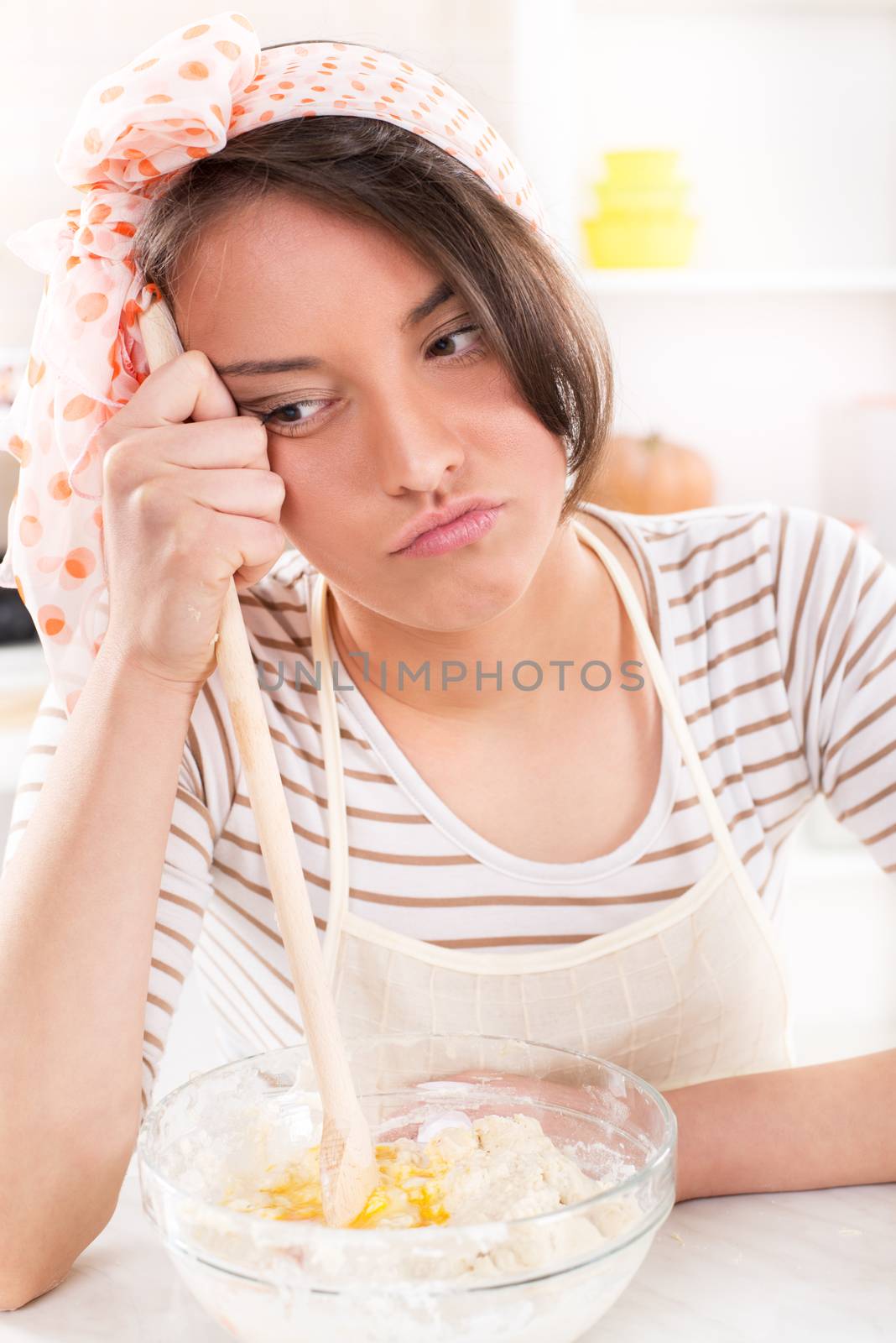Frustrated Young woman making dough
