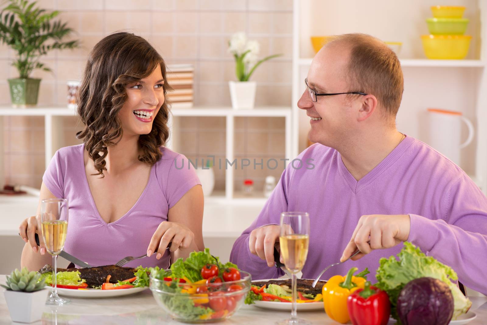 Happy Couple having dinner in a kitchen