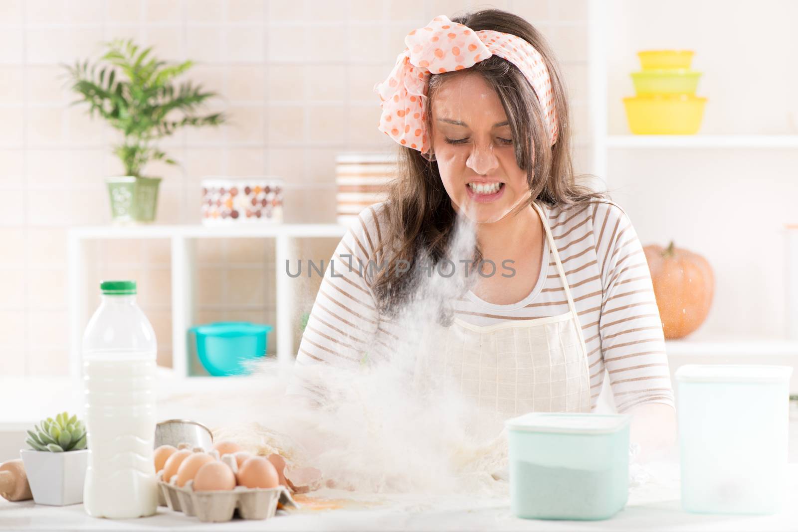 Frustrated Young woman making dough