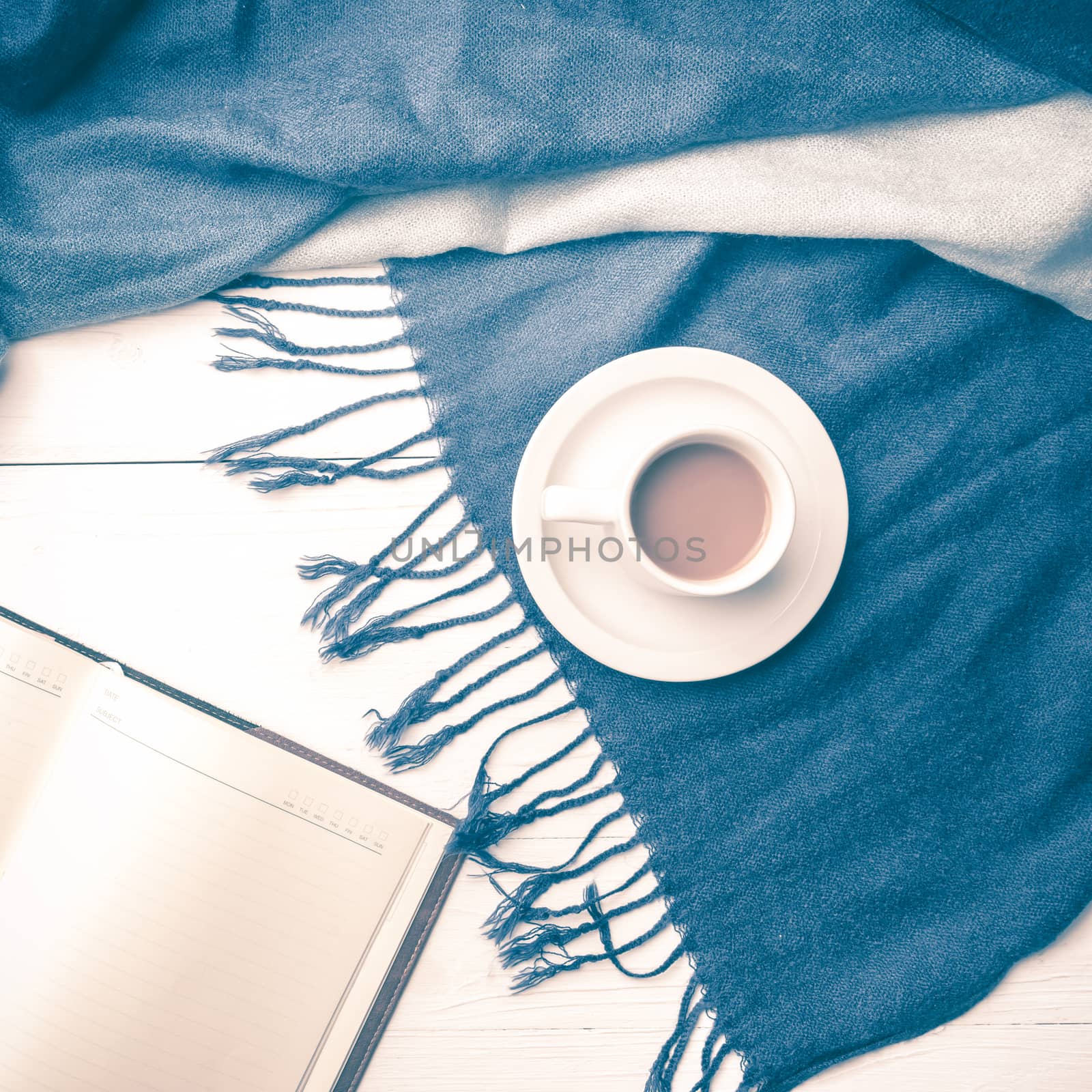 coffee and scarf background on white table vintage style