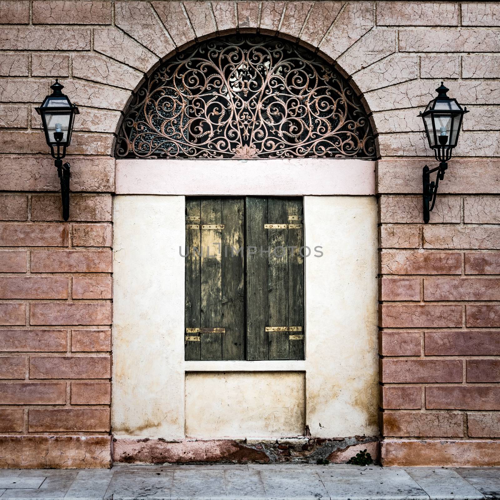 Facade of an ancient Italian villa with artistic iron grill. by Isaac74