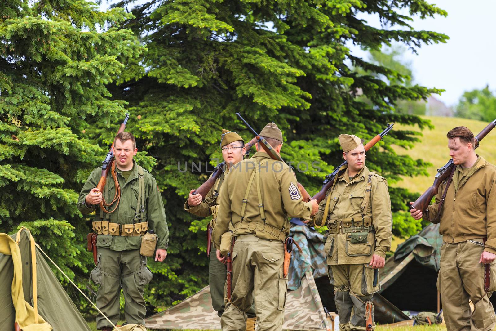 The Military Museum organized "Summer Skirmish" event where an unidentified soldier is seen in a historical Reenactment Battle. German and US soldiers in uniform.