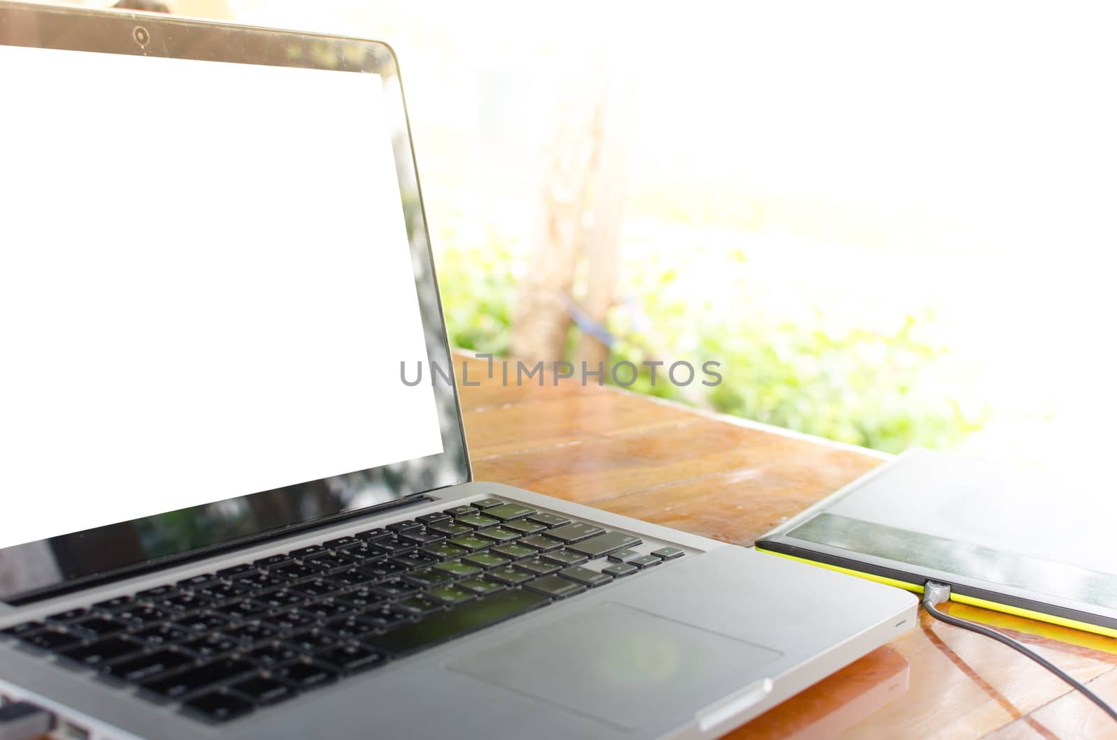 laptop computer on wooden desk as concept with overcast effect