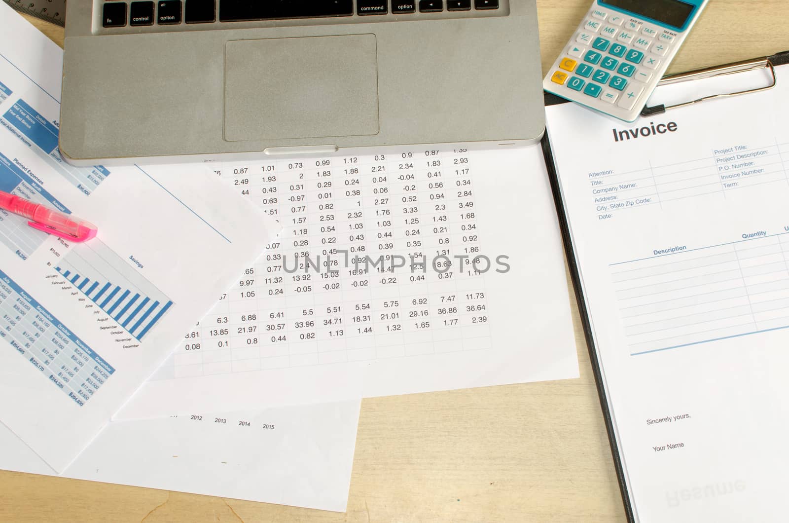 Financial documents and computers calculator