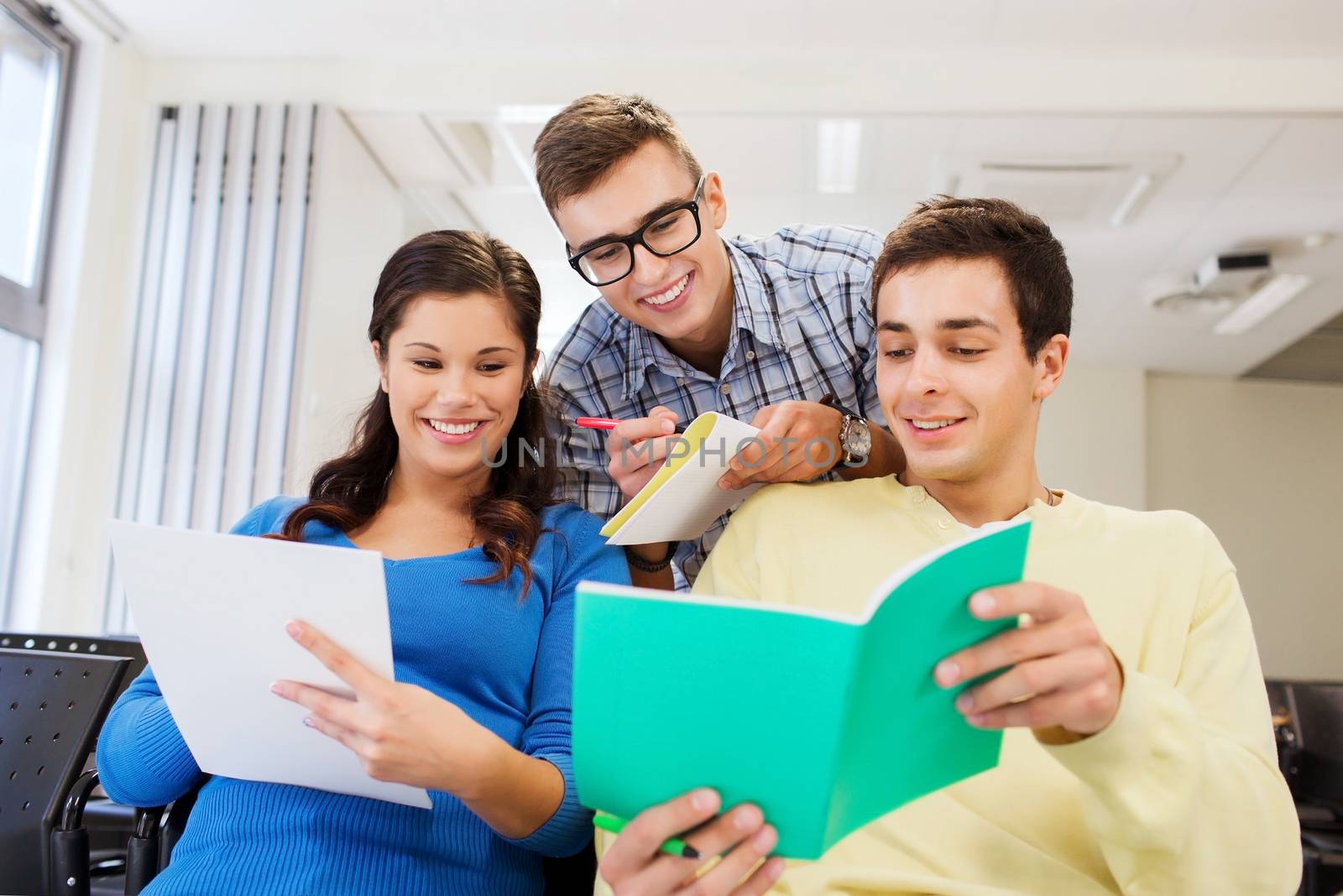 group of smiling students in lecture hall by dolgachov