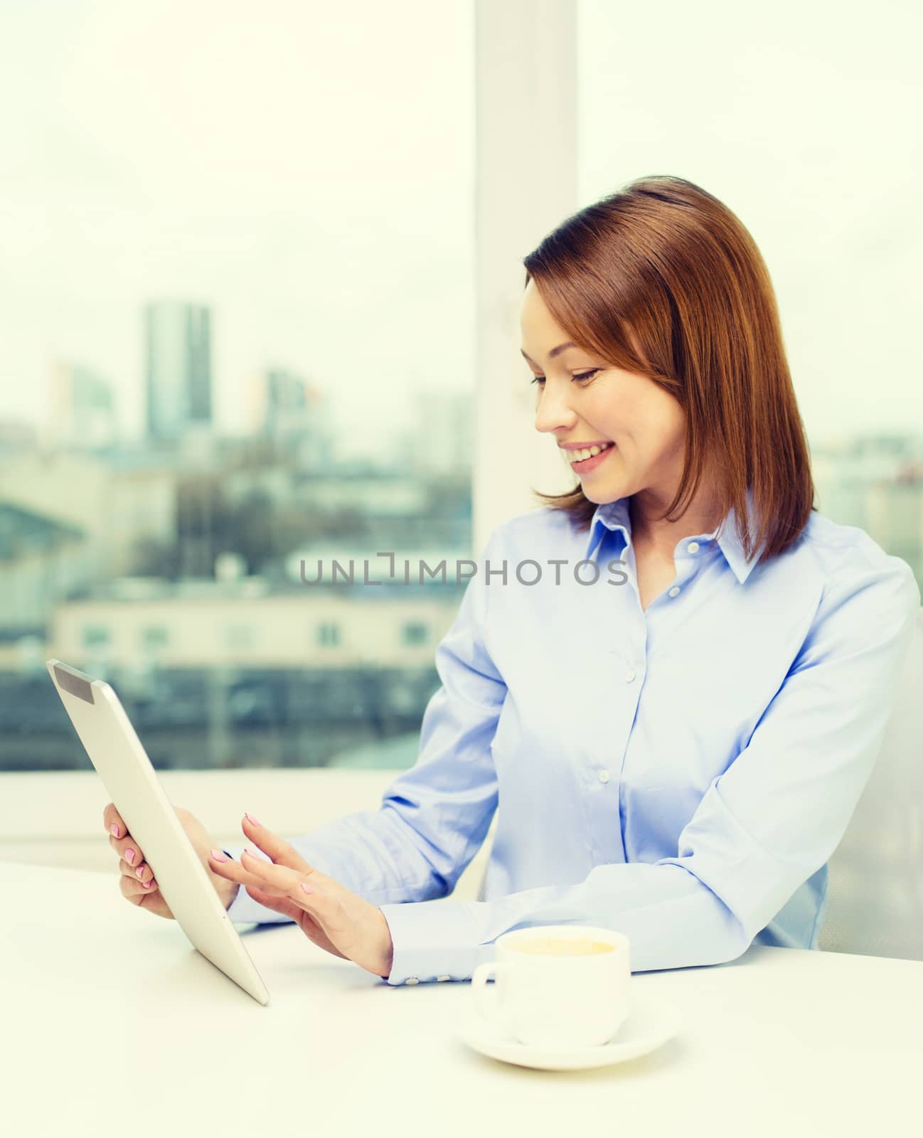 office, business, technology and internet concept - smiling businesswoman with tablet pc and coffee in office