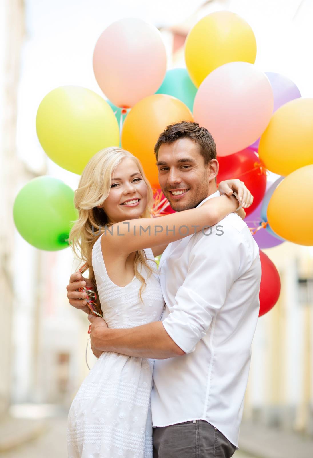 couple with colorful balloons by dolgachov