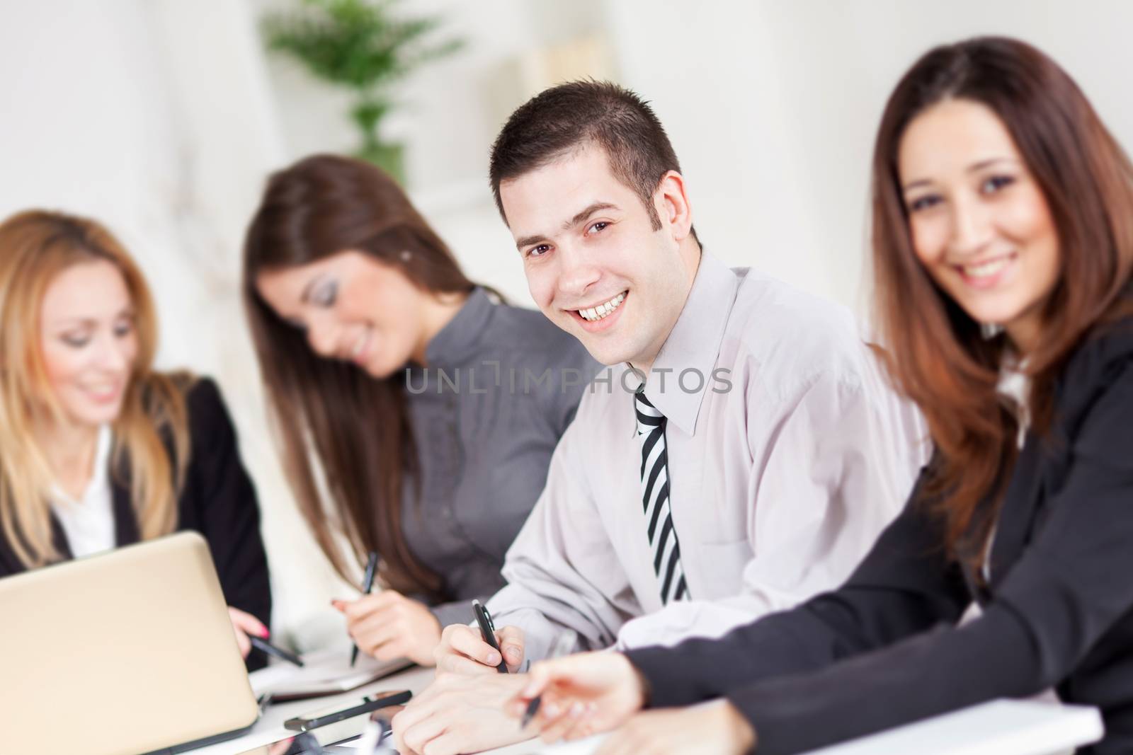 Happy Businessman in the office. Looking at camera.