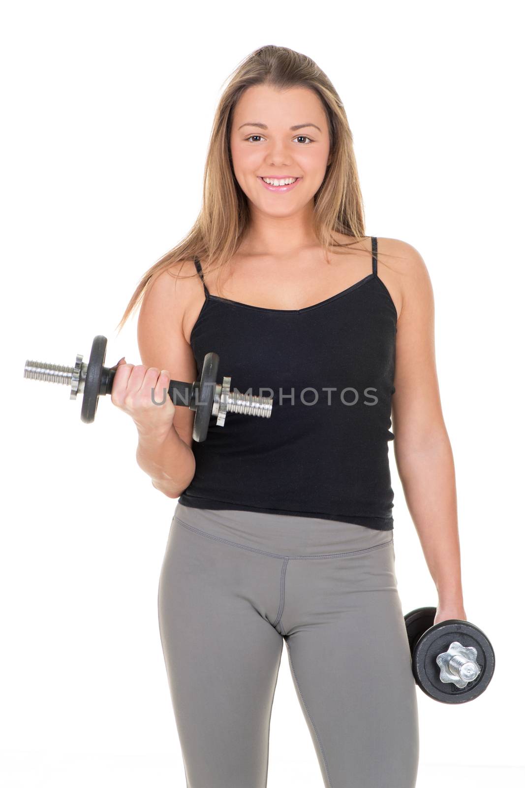Cute Sporty young woman doing exercise to strengthen her biceps with dumbbells.