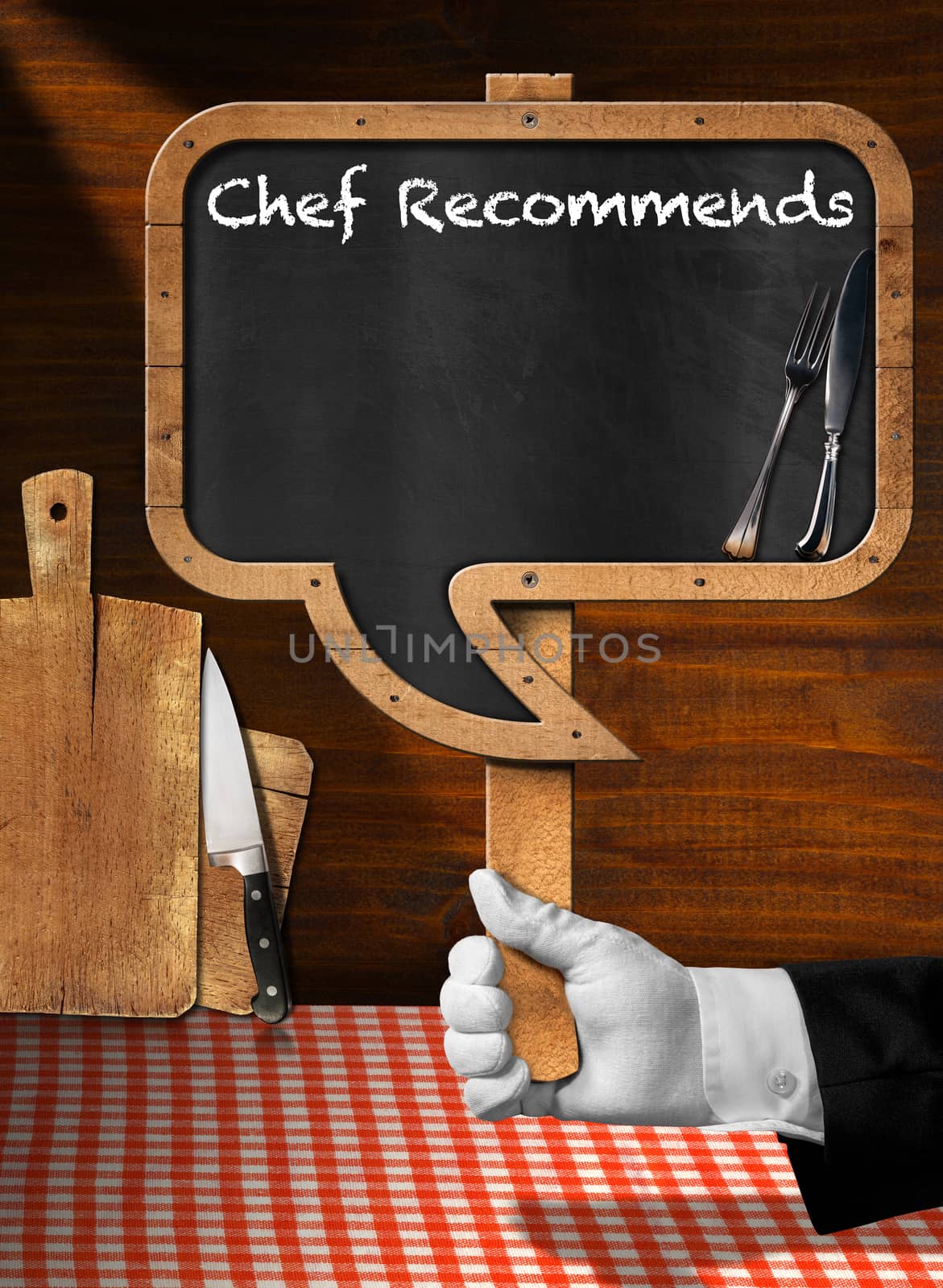 Hand of chef with white glove holding a pole with empty blackboard in the shape of speech bubble with text Chef Recommends