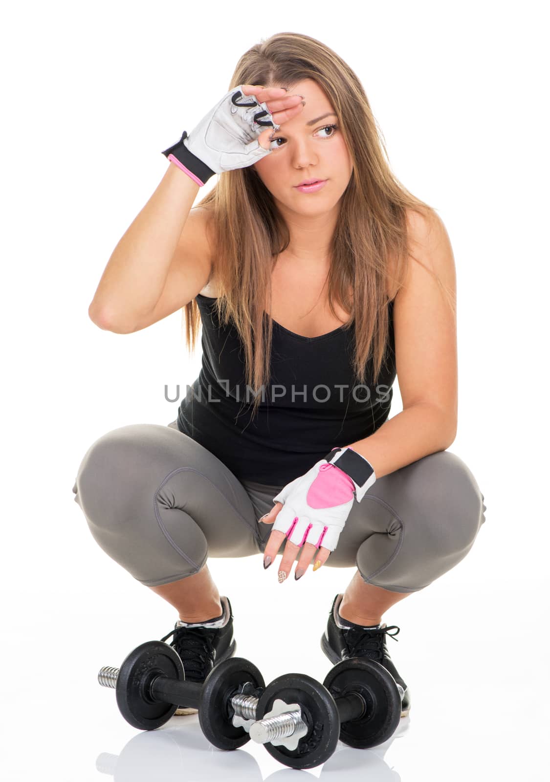 Cute sporty Young girl resting near Dumbbell.