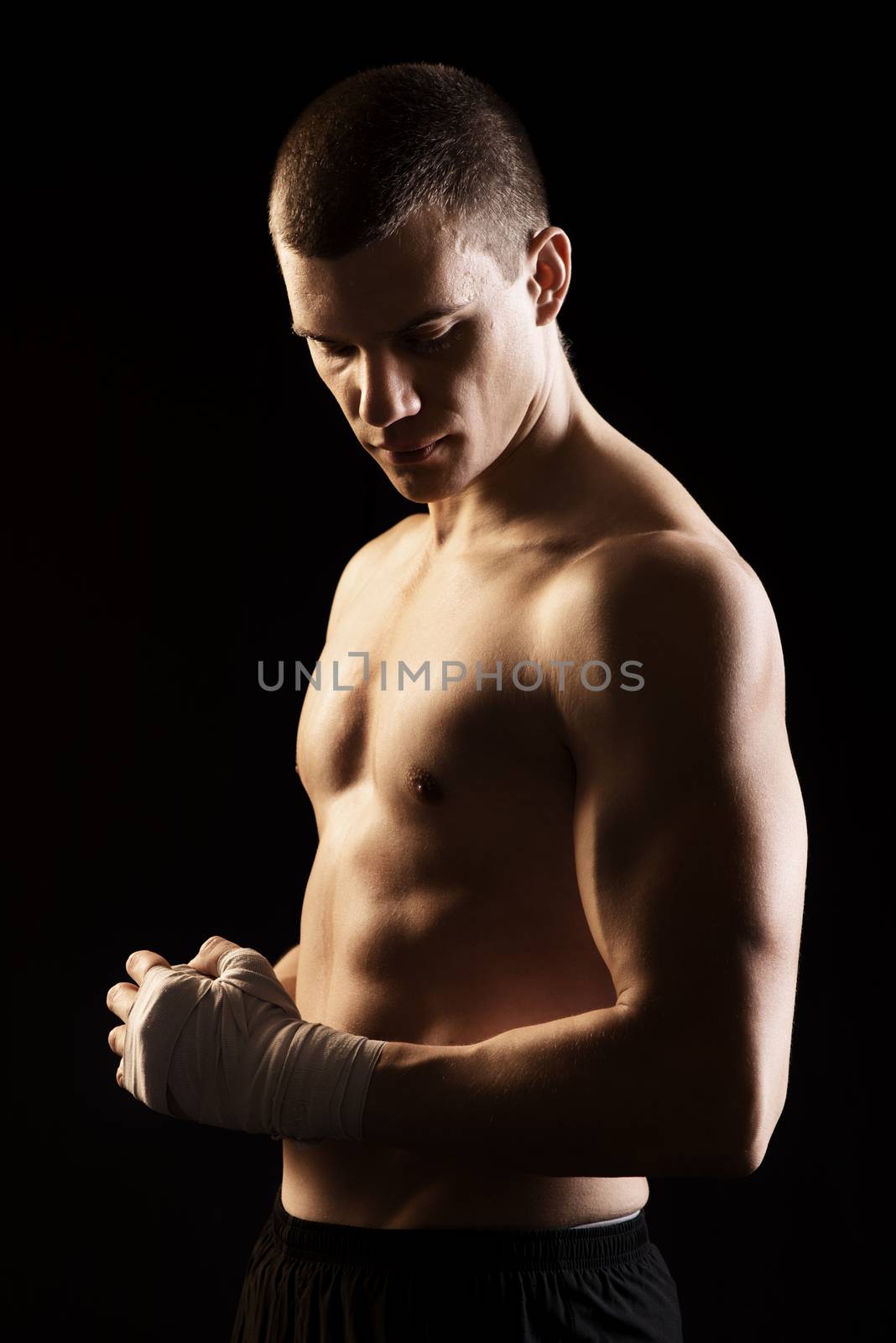 Male Martial Arts Fighter is preparing for fight.