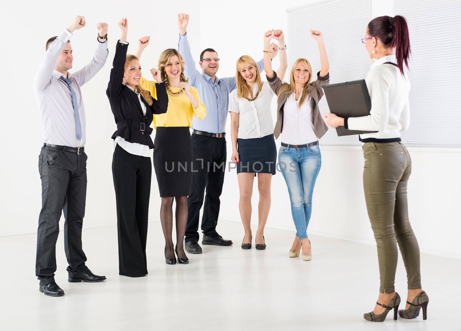 Successful business team congratulates colleague on Successful Presentation.