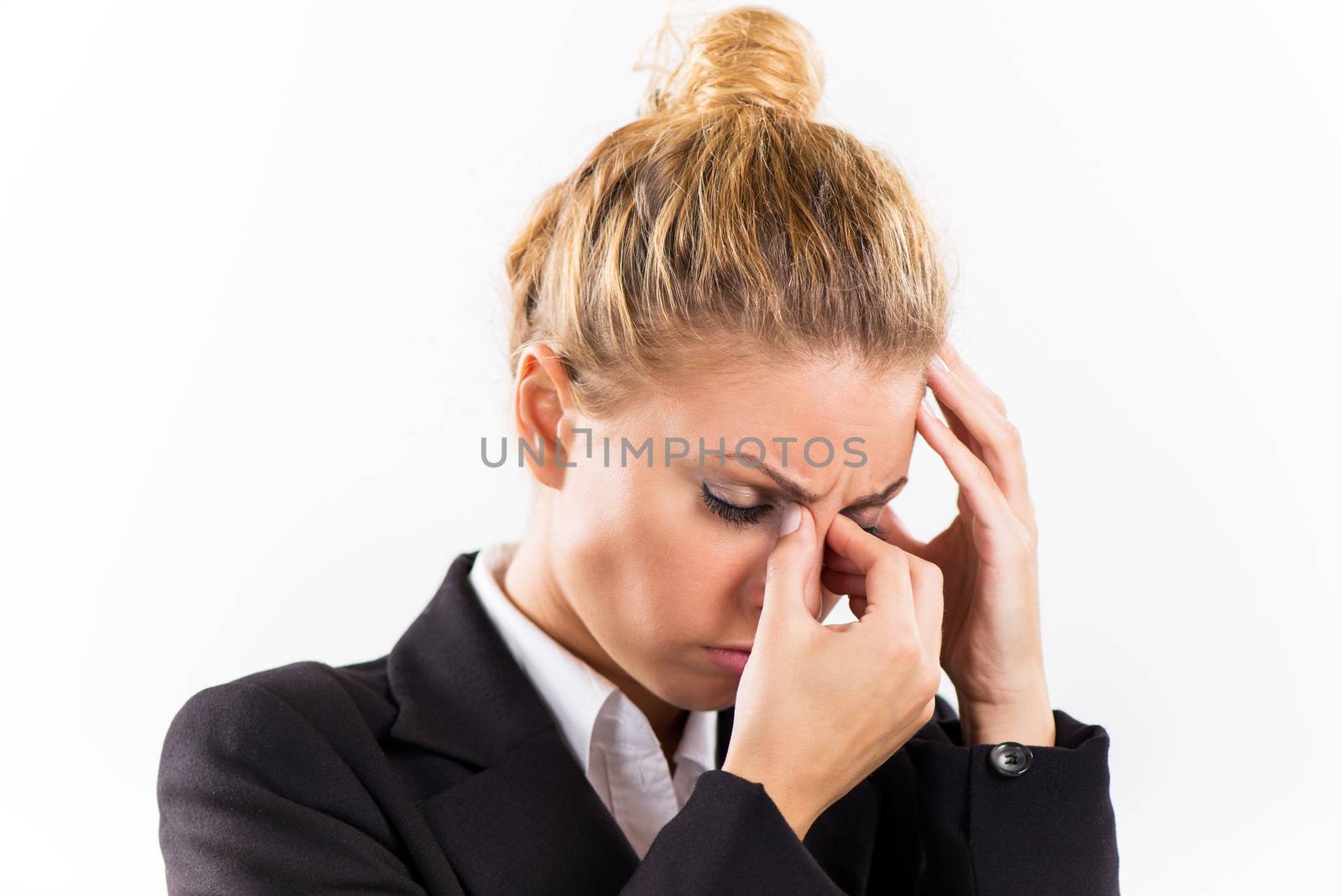 Portrait of attractive businesswoman with a headache.
