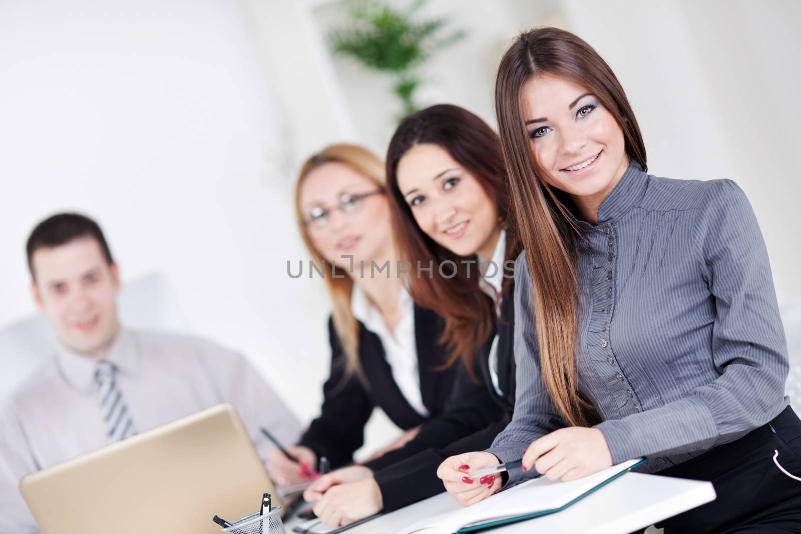 Happy young Businesswoman in the office, Looking at camera.