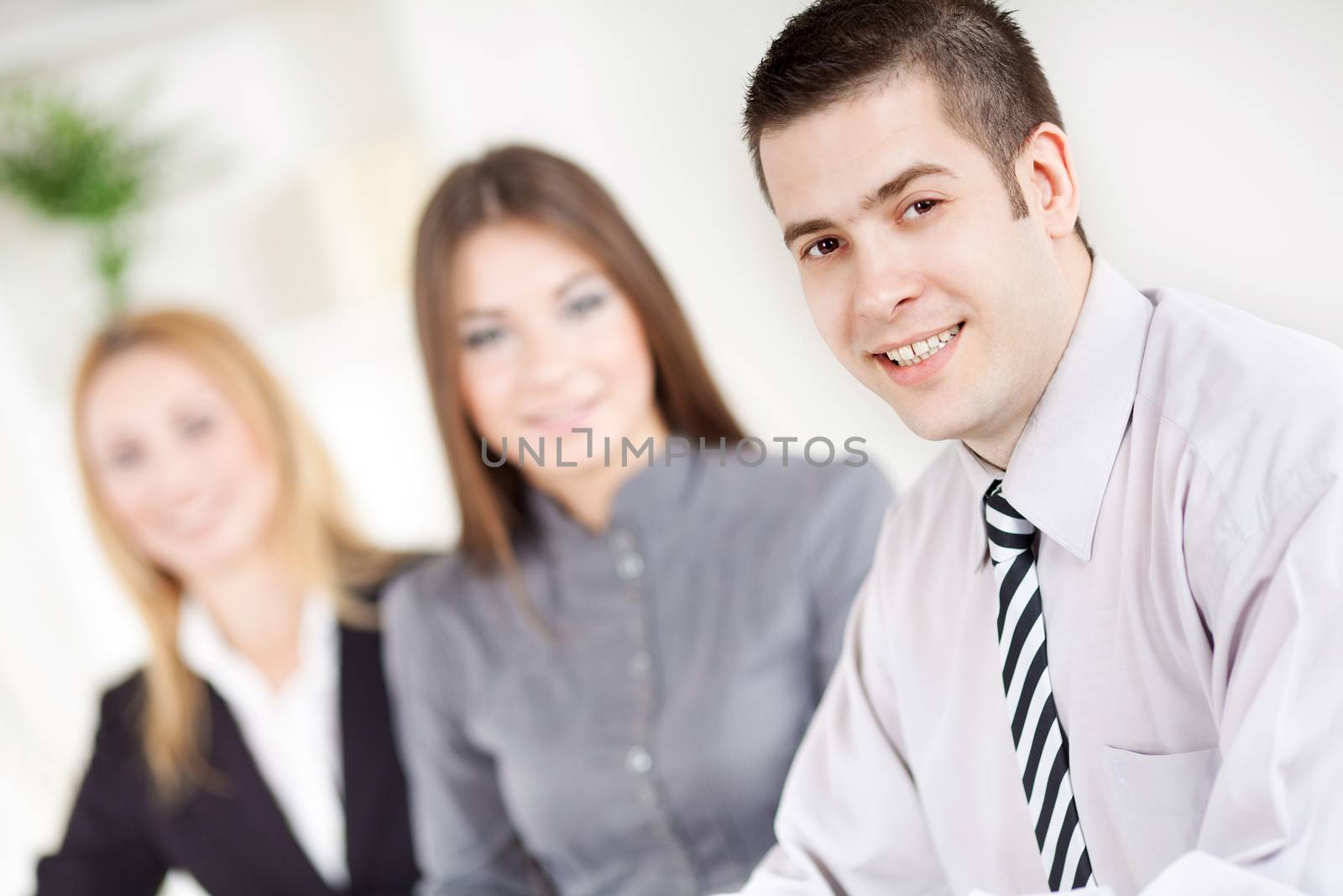 Happy young Businessman in the office, Looking at camera.