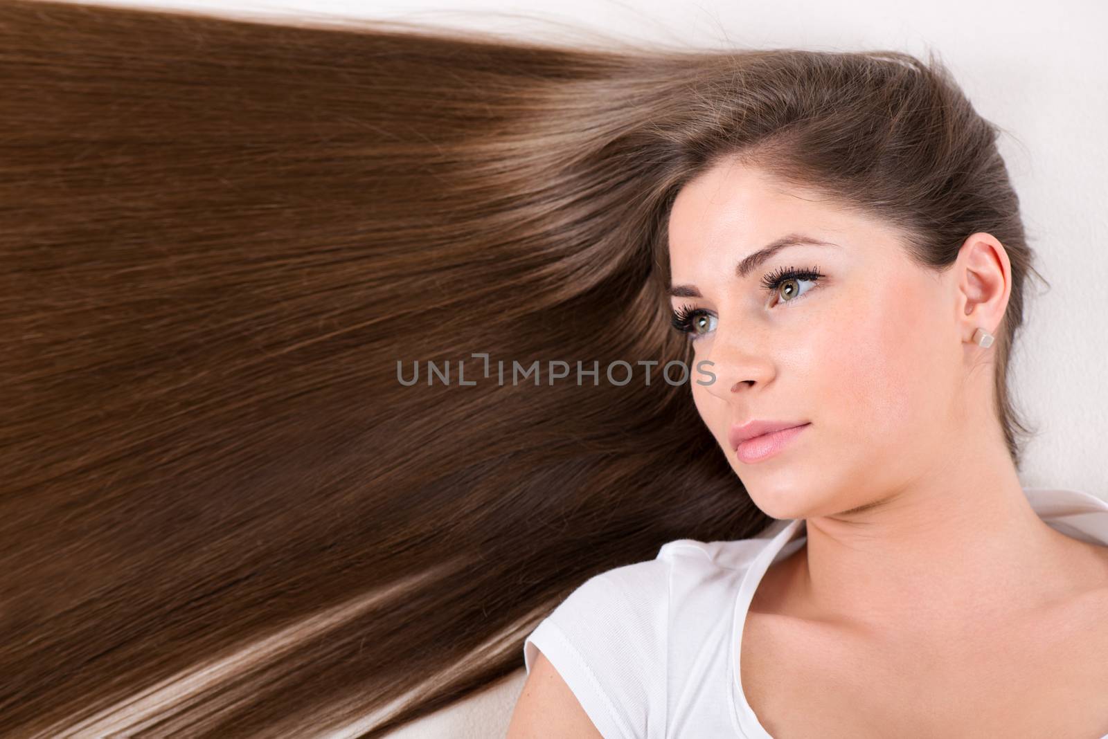 Portrait of Cute young girl with Beautiful healthy shiny hair.