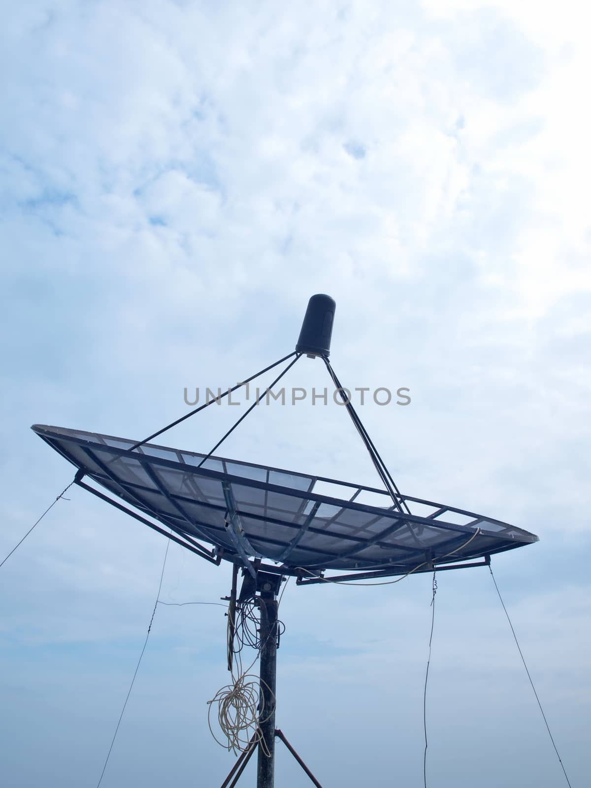 Satellite dish with cloudy and blue sky