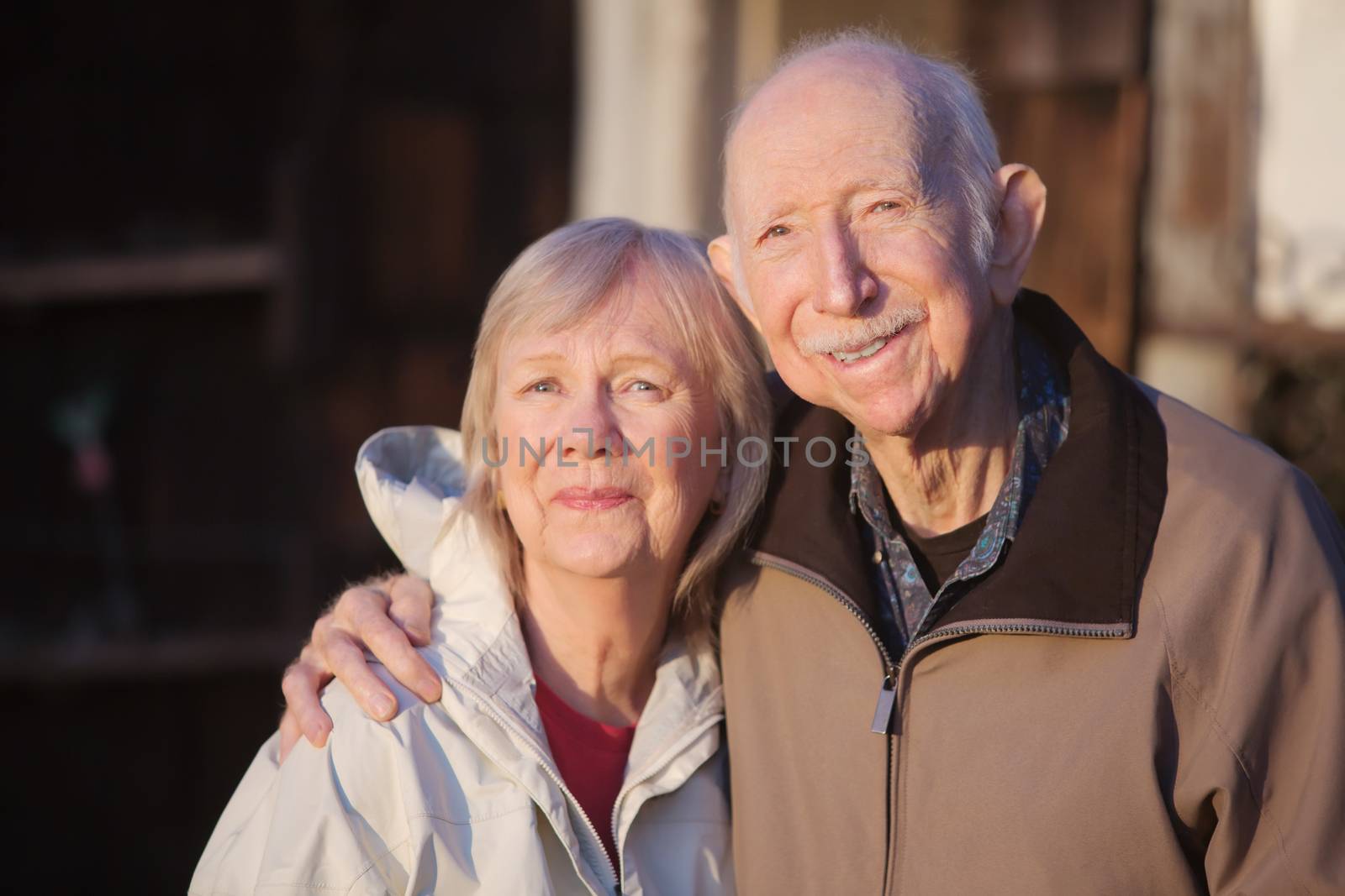 Happy male and female partner embracing outdoors