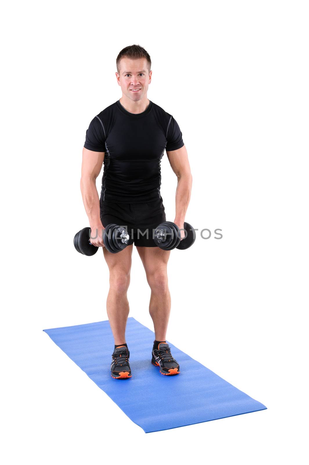 young man fitness instructor shows starting position of standing dumbbell lateral raise, isolated on white