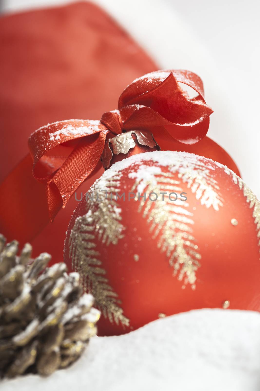 Christmas ball with red bow and ribbon