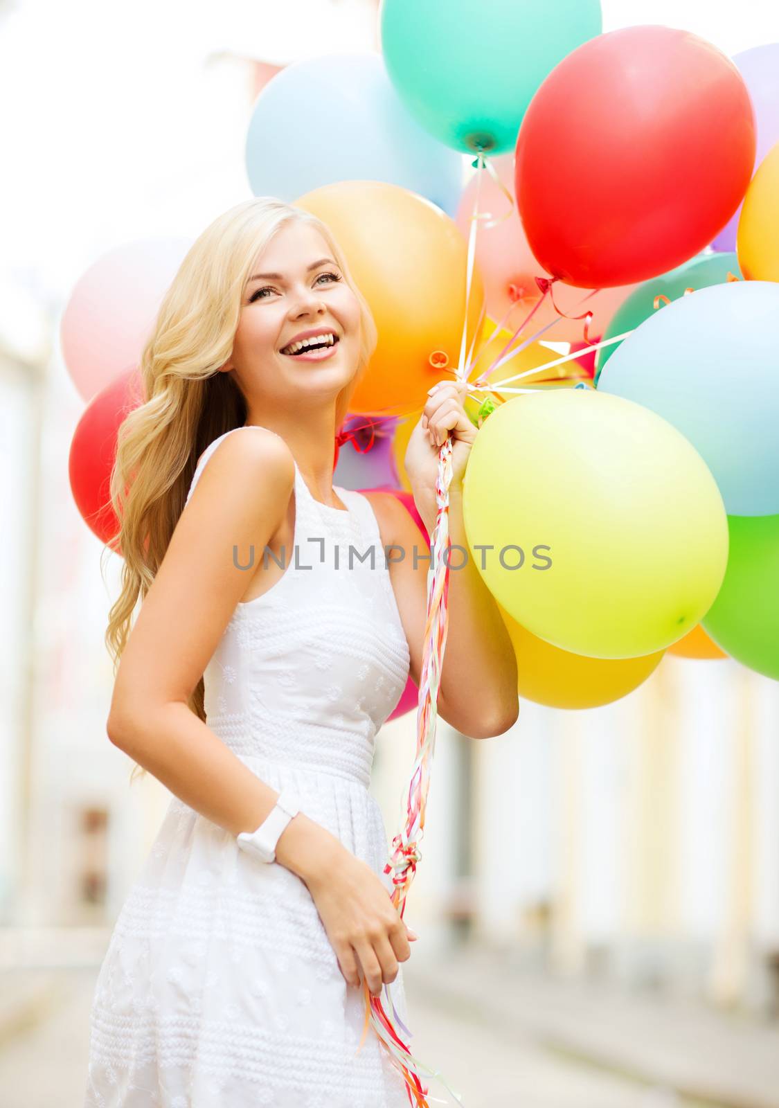 summer holidays, celebration and lifestyle concept - beautiful woman with colorful balloons in the city