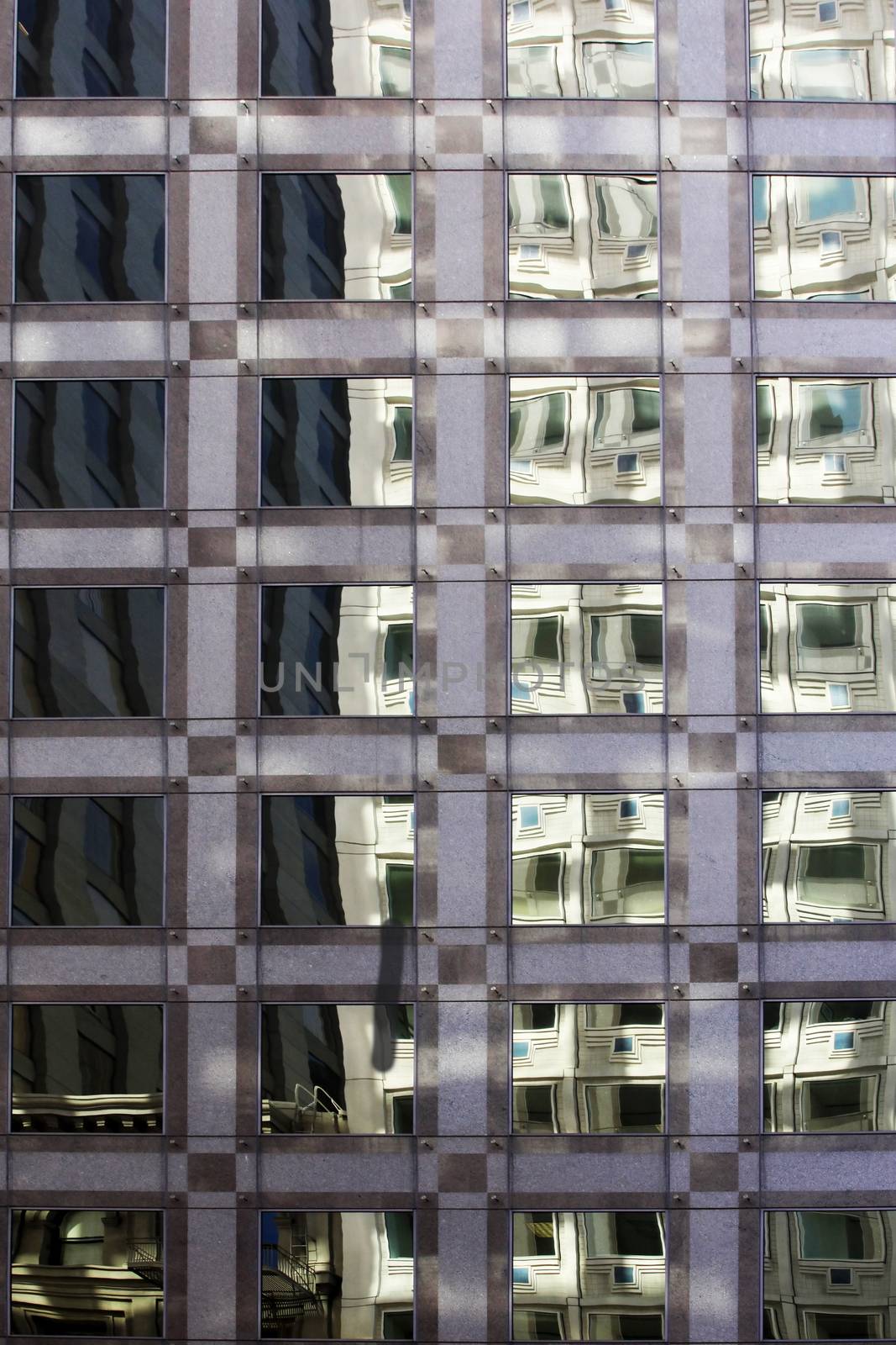The facade of a modern apartment building with reflection