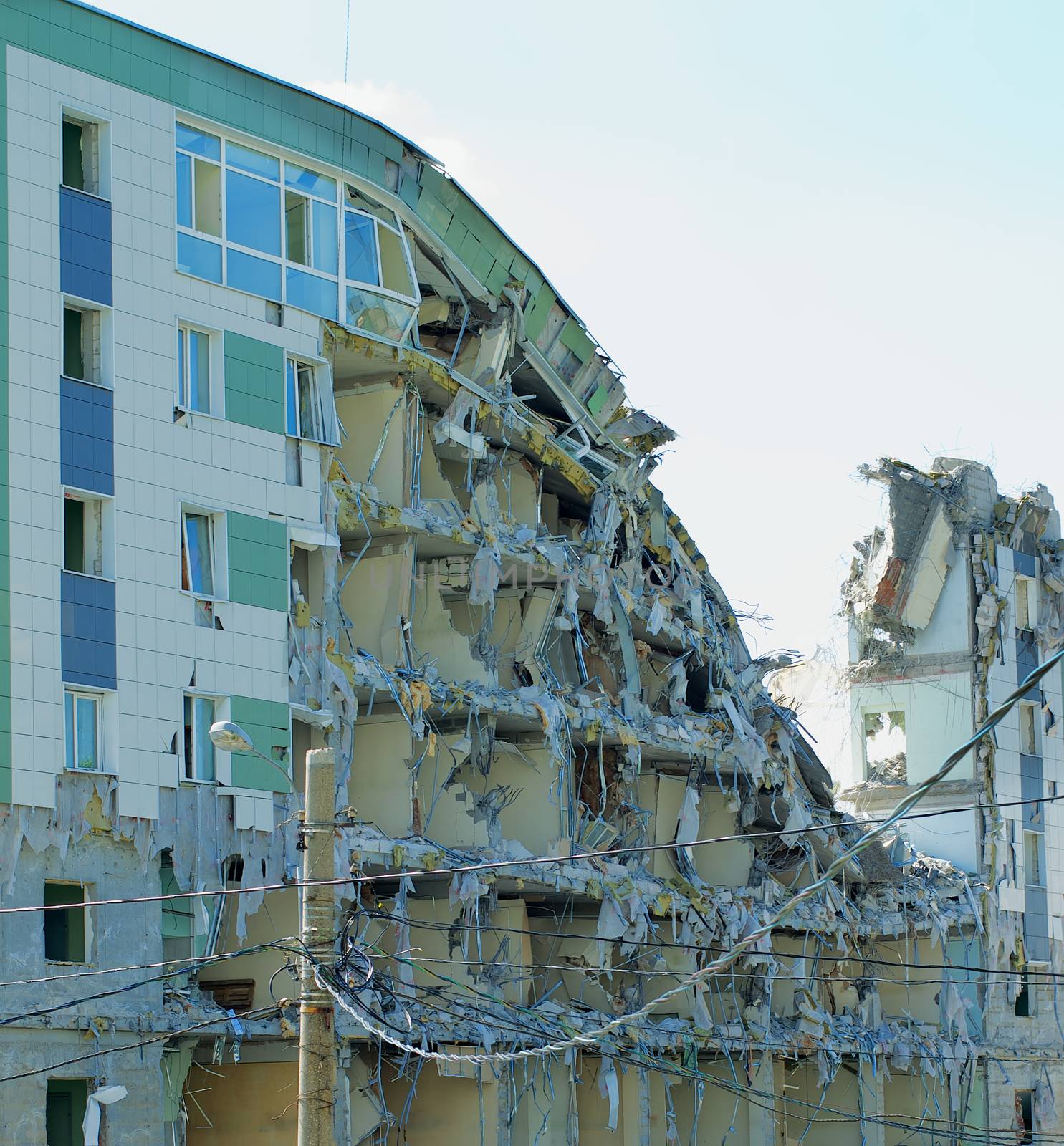 Destroyed Modern Building with Plastic Windows, Electric Cables and Facade Constructions Outdoors
