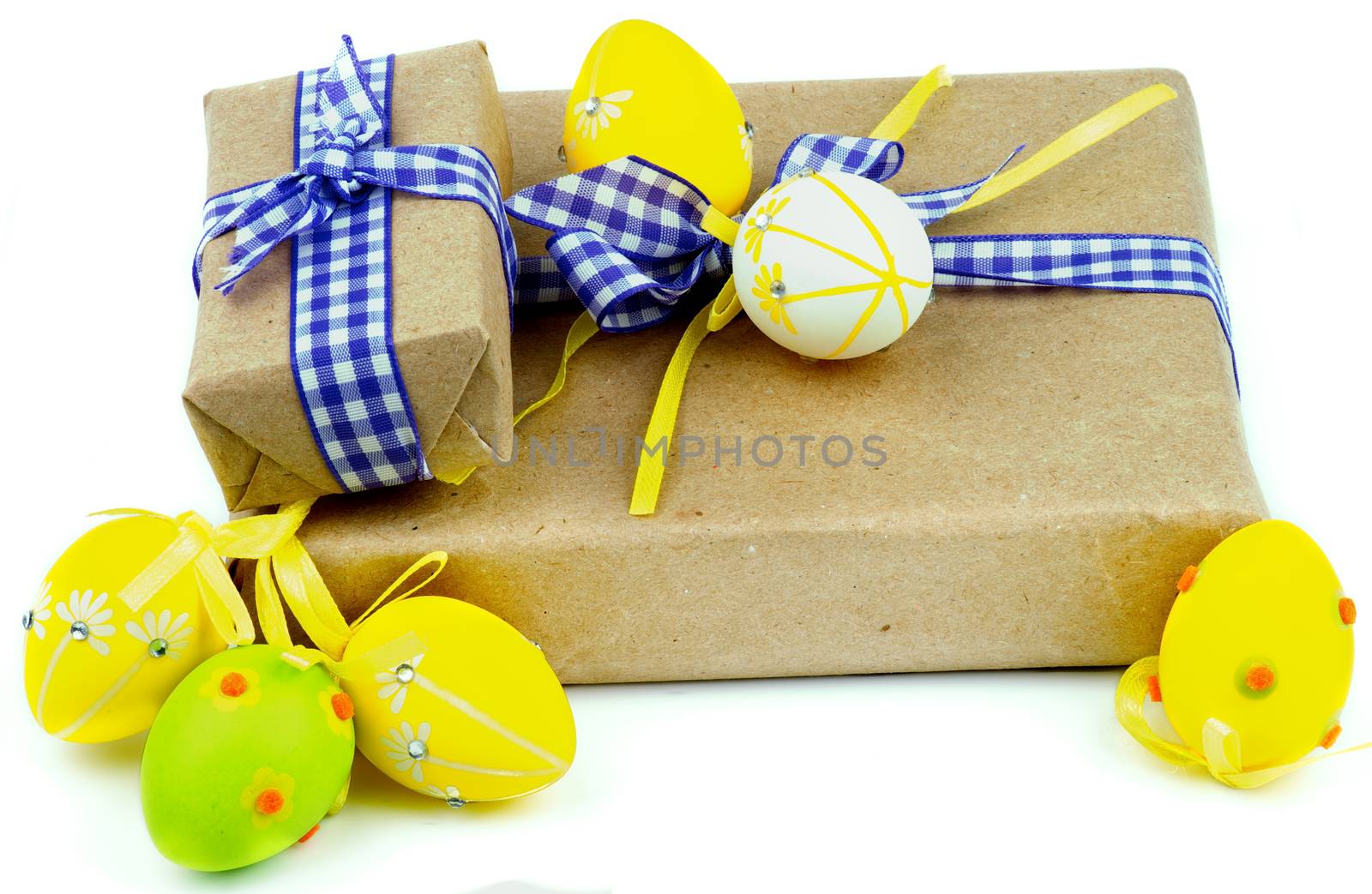 Two Easter Gift Boxes Decorated with Checkered Ribbons and Yellow and Green Easter Eggs isolated on white background