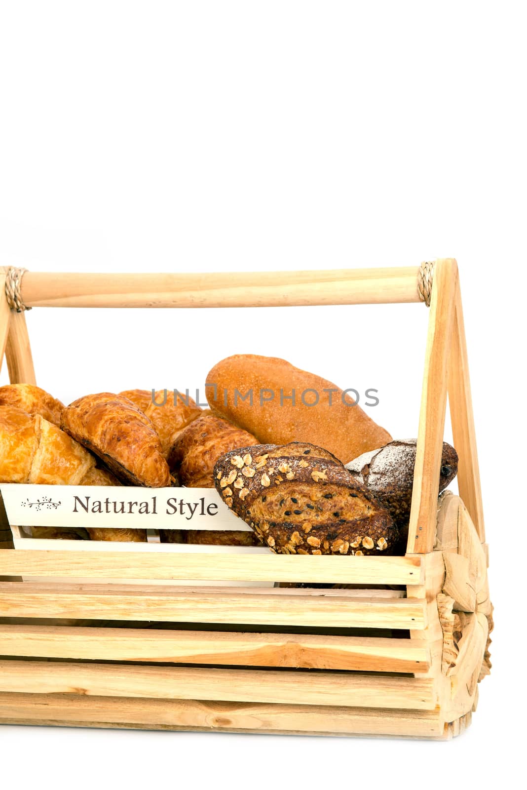Composition with bread in basket isolated on white .