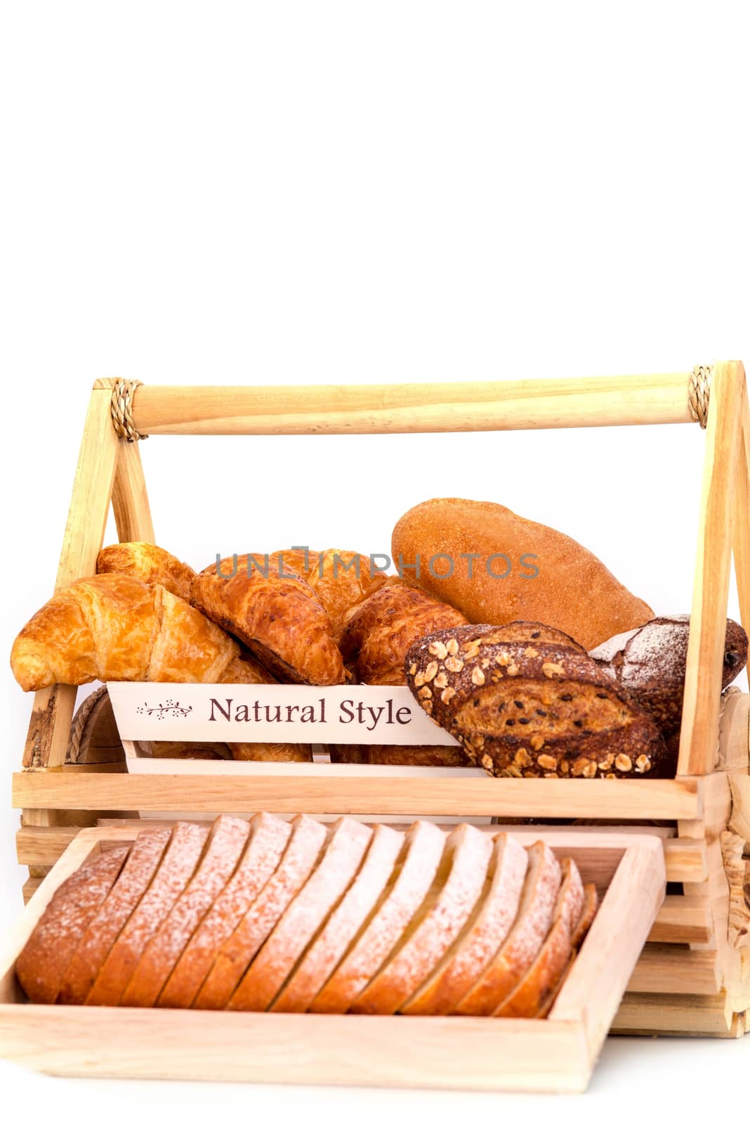 Composition with bread in basket isolated on white .