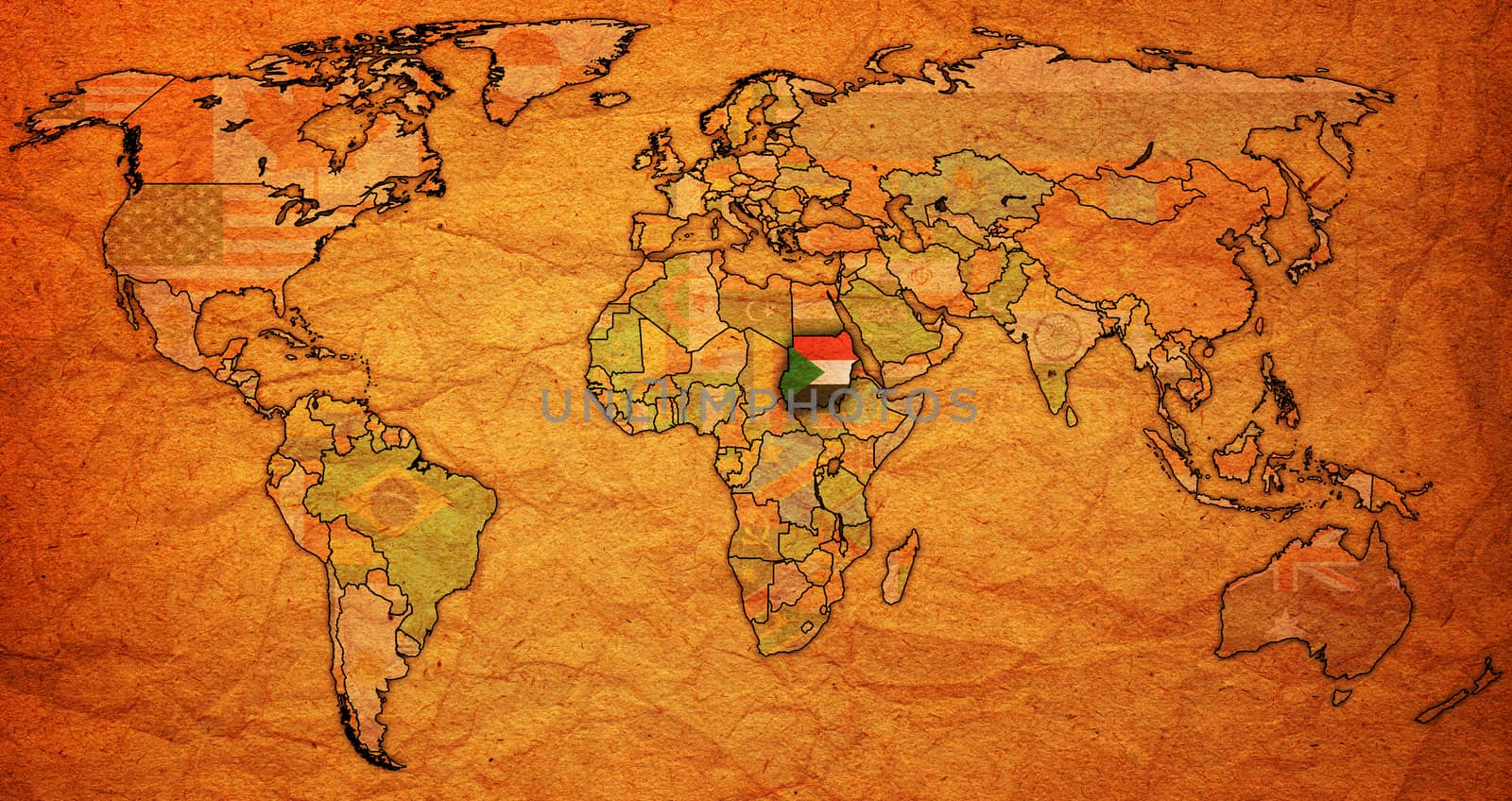 sudan flag on old vintage world map with national borders