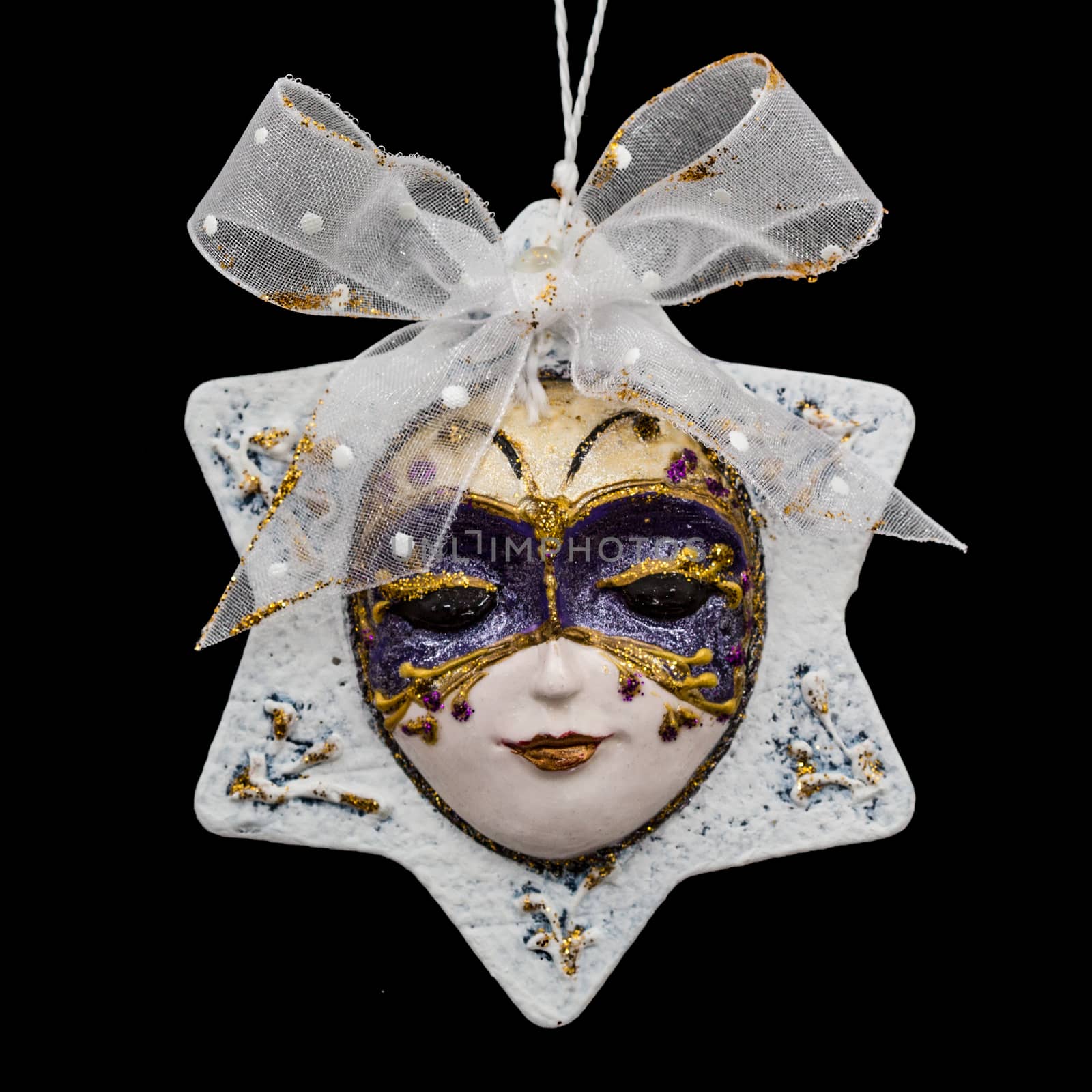 Beautiful mask of hand-worked for festive decoration, isolated on black background