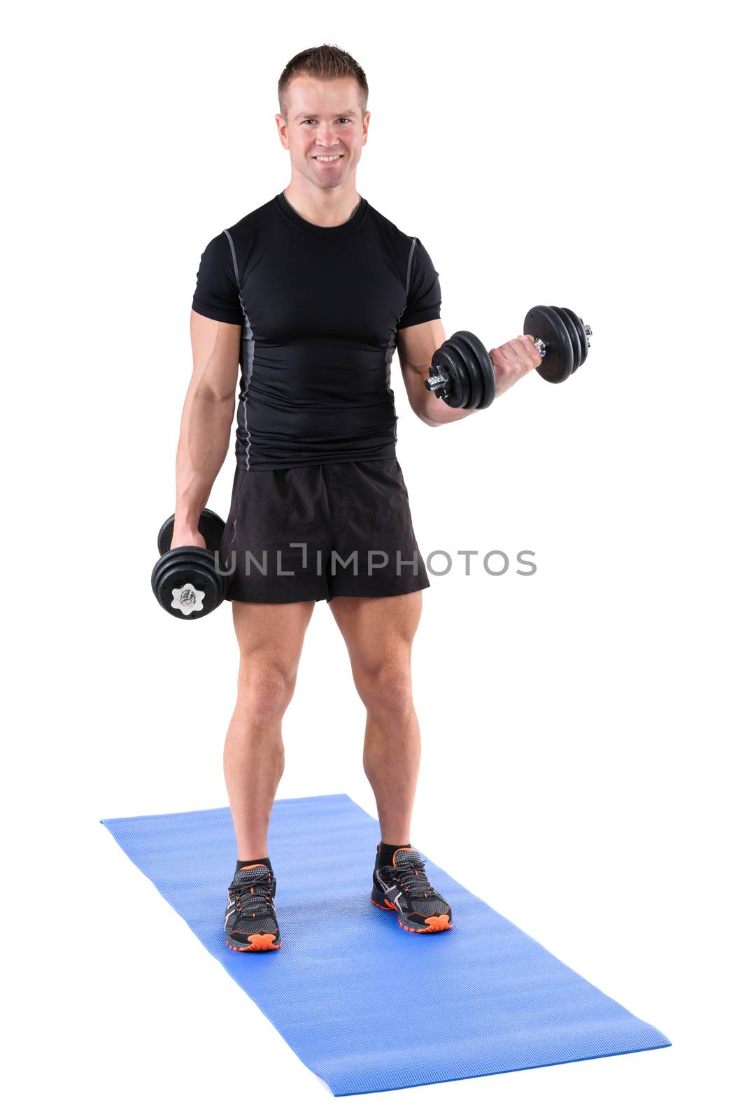young man fitness instructor shows finishing position of standing dumbbell dumbbell biceps curl, isolated on white