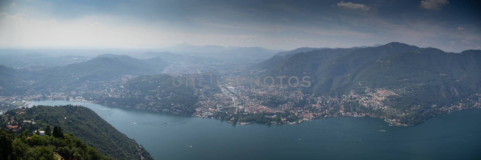 Como lake landscape with boats and water in summer travel