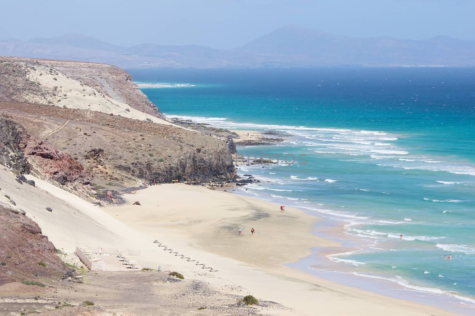 Mal Nombre beach or Playa del Mal Nombre on a windy day, with its golden sand, situated on the south east coast of the island of Fuerteventura, Canary Islands, Spain.