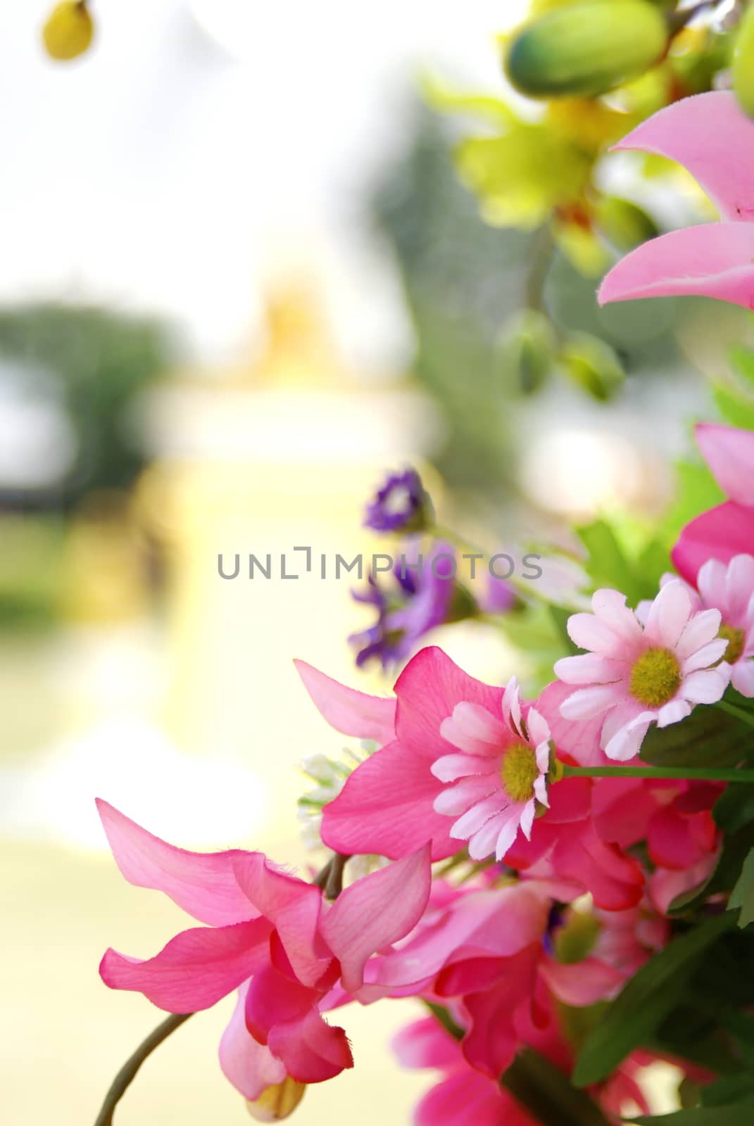 Pink artificia flower on blurred background