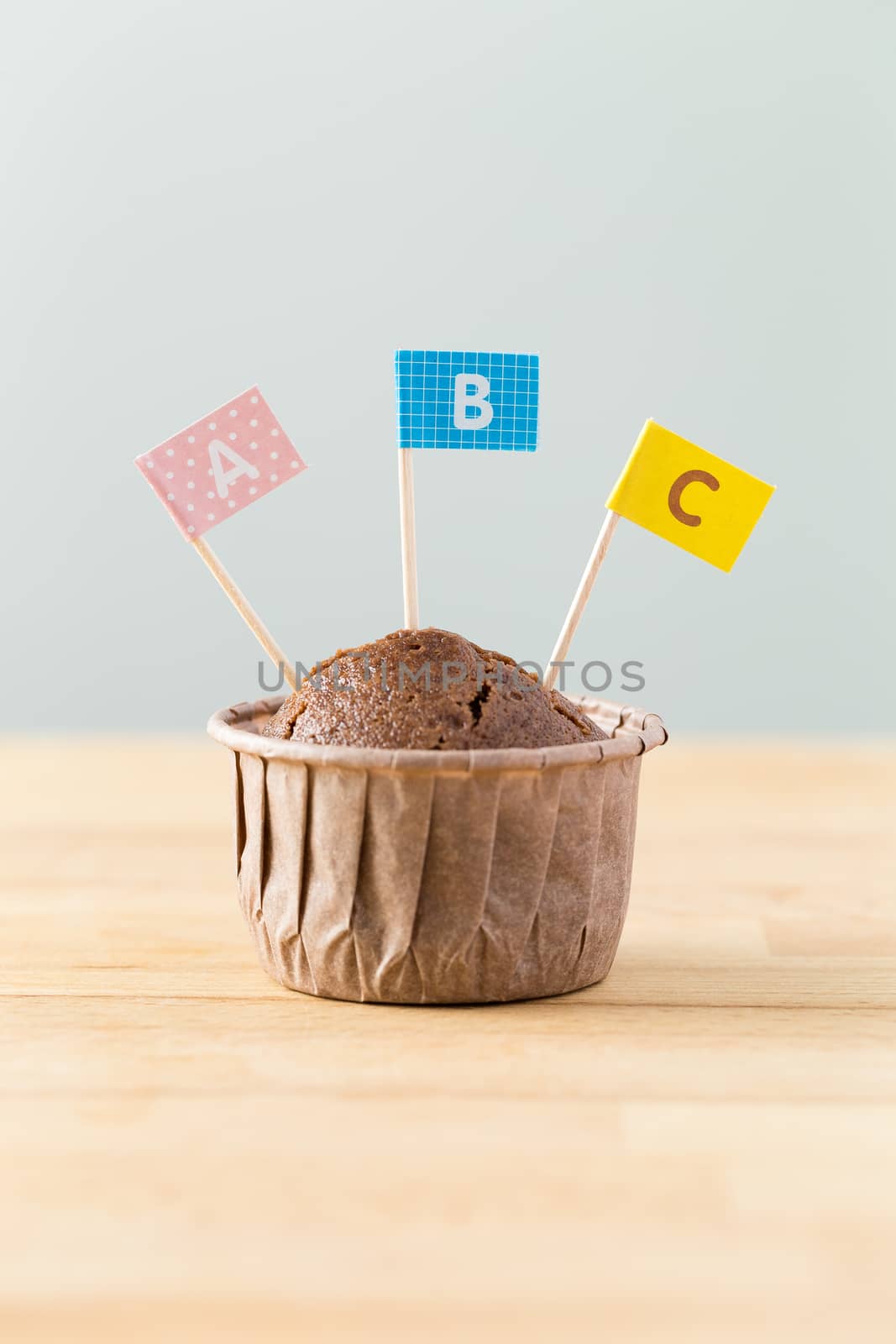 Chocolate muffins with small flag of word ABC