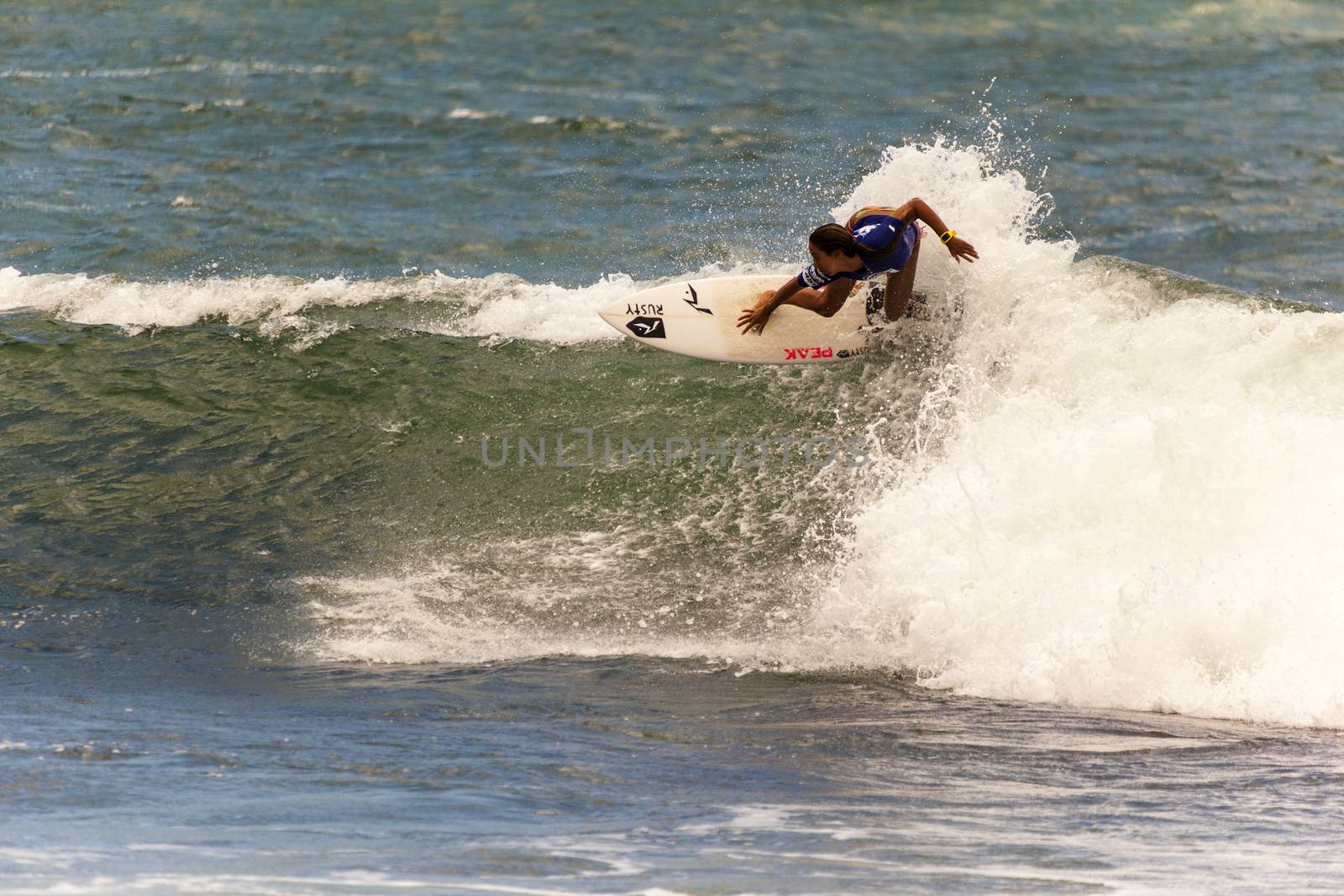 Professional female surfer compete on the Burleigh Pro 2013 by Imagecom