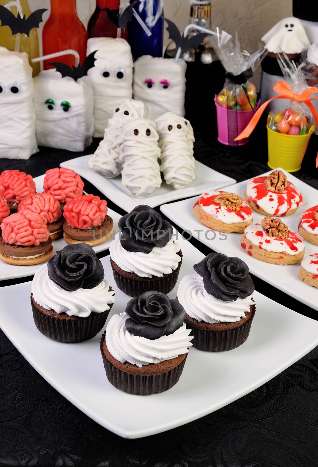 Table served with a variety of sweets and drinks on Halloween