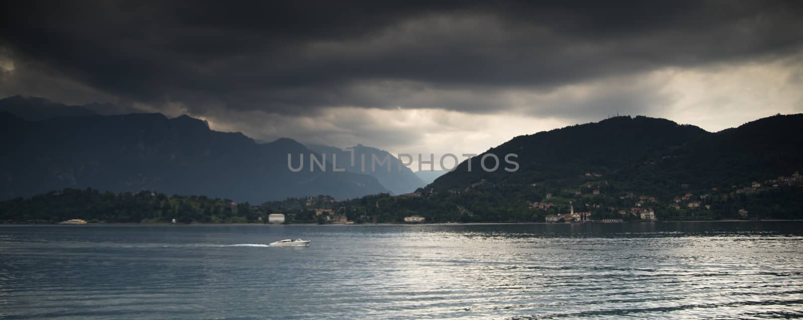 Travel on water of Como lake near Bellagio villas