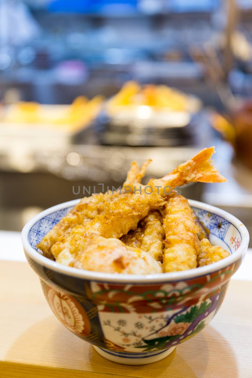 Tempura served over a bowl of rice