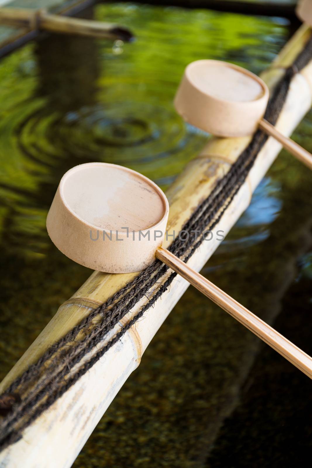 Traditional Japanese bamboo fountain dripping water