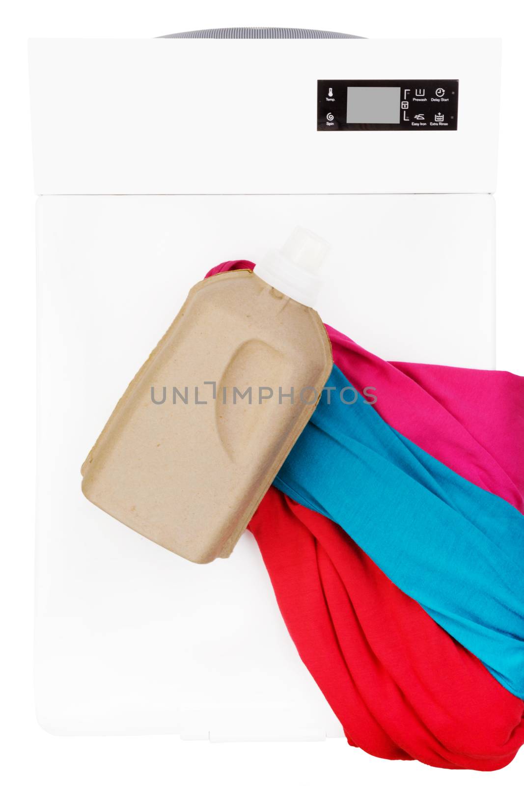 Laundry background. Top loading washing machine with natural organic detergent and colorful clothing isolated. 