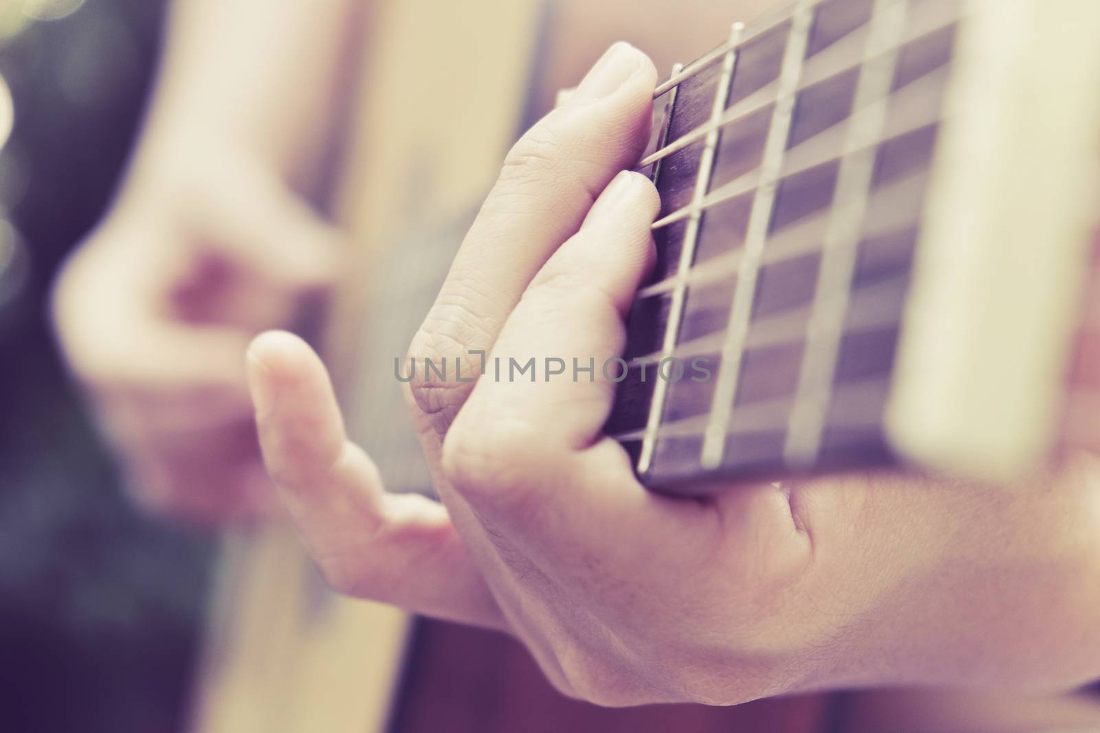 Close up image of Man playing his guitar Background