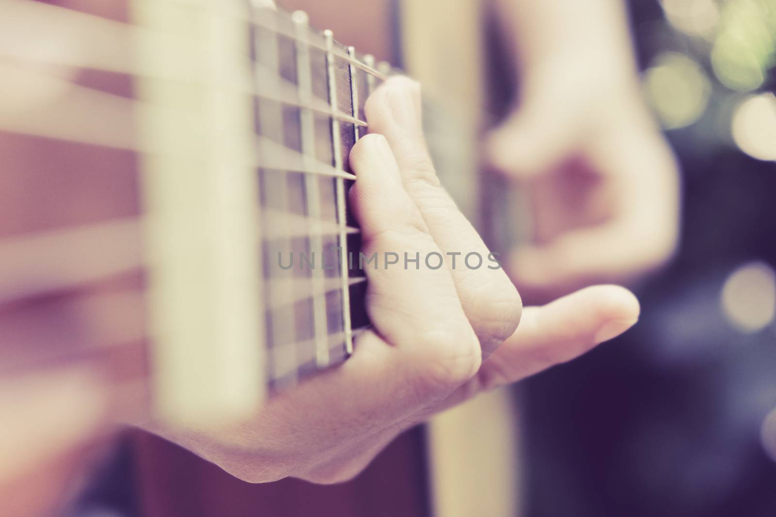 Close up image of Man playing his guitar Background